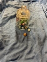 Glass jar of assorted marbles