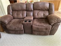 Suede reclining love seat with center console