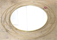 Gold 34" wall mirror by Three Hands