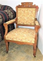 Antique Eastlake Arm Chair on Front Casters