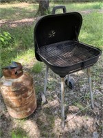 Small grill and propane bottle