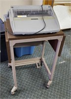 Rolling table and typewriter