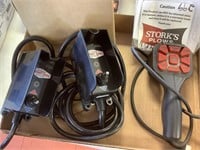 Two Tommy Gate hydraulic switches.  Storks plows