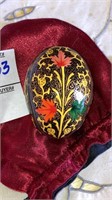 Ornate pysanky egg in satin pouch