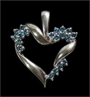 14K White gold heart shape pendant with 19 blue