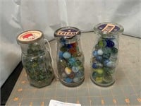 3 old milk/cream bottles with marbles