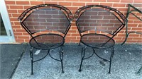 (2) black Wrought iron chairs with circular seats