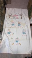Handmade baby quilt embroidered bunnies