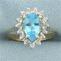 Blue Topaz and Diamond Halo Ring in 14k Yellow Gol