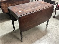 Antique drop leaf table with carved legs