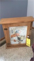 WOODEN CABINET WITH ARTWORK ON FRONT, AND A TABLE