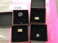 Four personalized class rings