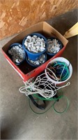 Five small buckets of white rock, bungee cords,