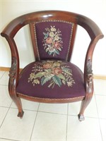 ANTIQUE NEEDLEPOINT CARVED ARM CHAIR ON CASTERS