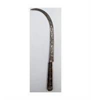 A Middle Eastern Incised Crescent Blade Knife