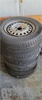 Four unmatched 185/70R13 Tires and rims