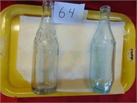 2 Embossed Soda Bottles