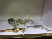 VINTAGE AVON SILVER AND GOLD CARS AND GUN BOTTLES