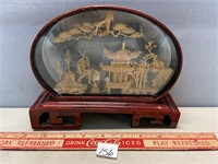 NEAT CARVED ORIENTAL CORK CARVING IN FRAME