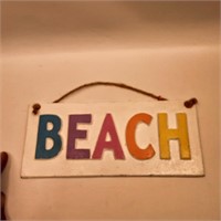 Beach cast iron colourful sign