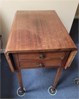 Drop leaf end table with 2 drawers.  27×22×16.