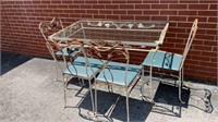 Wrought Iron glass top table & 4 chairs, has