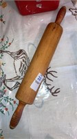 Red-handled wooden rolling pin