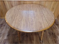 Dining table with drop down sides and two 12in