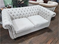 Nice Upholstered Button and Tuck Loveseat