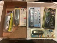 Flat of assorted tv remotes