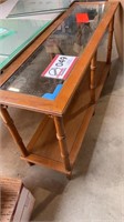 Glass top coffee table chipped under blue end