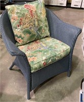 Wicker patio arm chair with padded cushion,