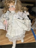 Doll with wicker chair