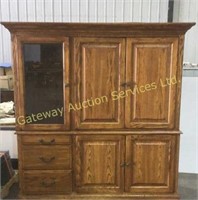 Oak television entertainment stand . Glass door