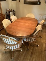 Oak table with 6 tilt back chairs
