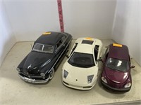 3 die cast cars