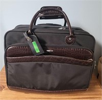 Travel briefcase with pull out handle and wheels.