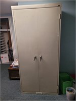 Sandusky metal storage cabinet with key.