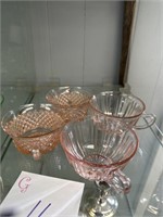 2 different patterns of pink depression glass