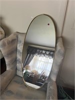 GOLD TONE FRAMED OVAL MIRROR