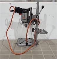 Black and Decker Drill attached to stand