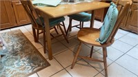 Oak dropleaf table and four chairs