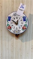 Small ceramic clock with pendulum