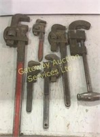 Vintage pipe wrenches and pipe cutter .
