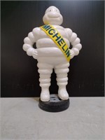 Michelin Man standing on tire. cast