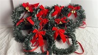 Wreaths with bows and bells. 8”