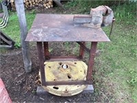Bench Vise attached to metal stand.