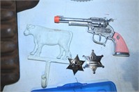 CAP PISTOL, BADGES AND IRON COW