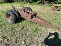 single axle dolly, Backhoe attaches to rear.