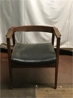 Vintage wooden chair with leather seat